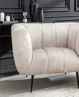 Estila Art deco moderní křeslo Vermont v krémovém champagnu čalounění na černých nožičkách 106cm