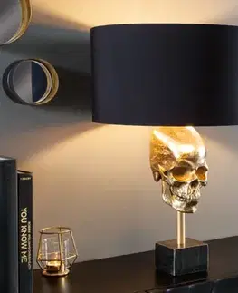 Estila Art deco stolní lampa Uma ve zlatém provedení s kovovou lebkou s černým kulatým stínítkem 56cm