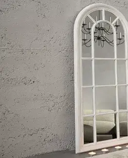 Estila Designové venkovské bílé nástěnné zrkadlo Castillo s obloukovým rámem s vintage efektem zešípané barvy 140 cm